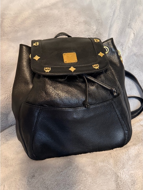 MCM Handbags - MCM Black Leather Backpack with Gold Logo Accents